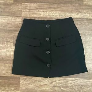 Black button mini skirt